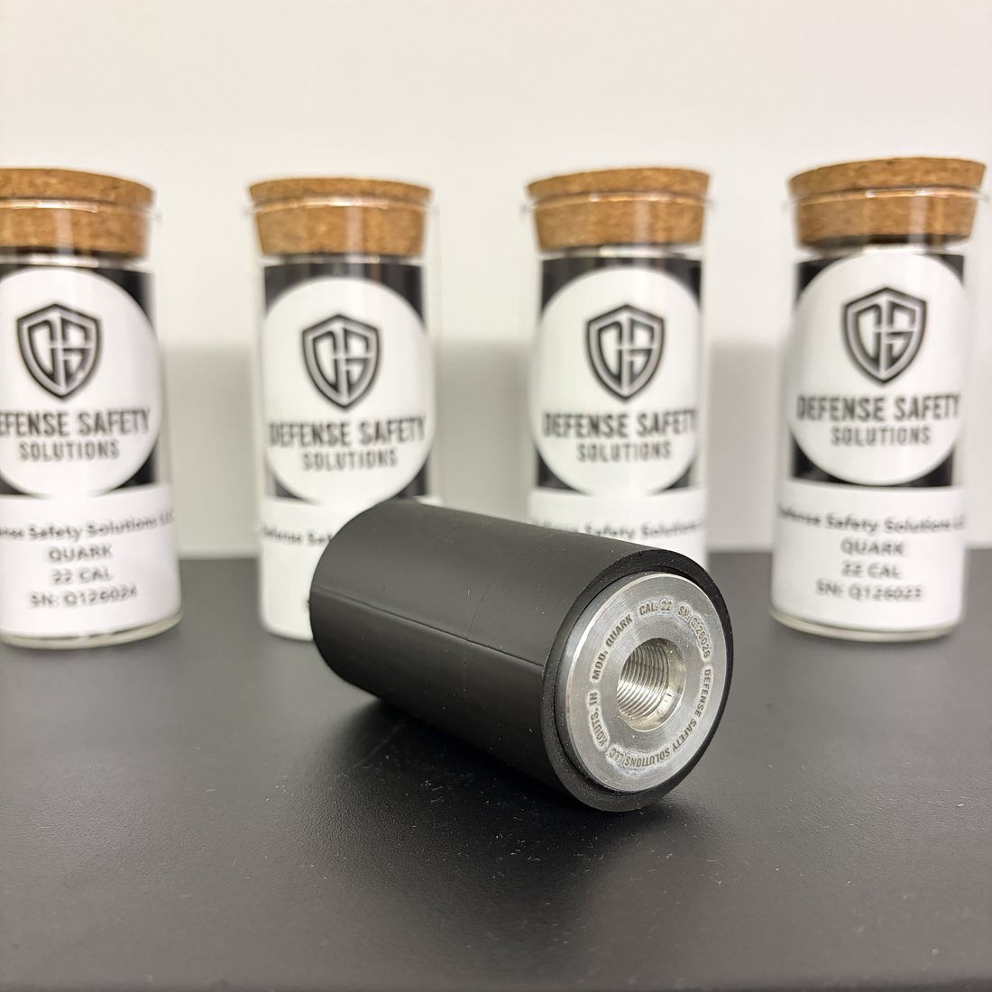 The QUARK .22LR rimfire suppressor with DSS branded storage vials